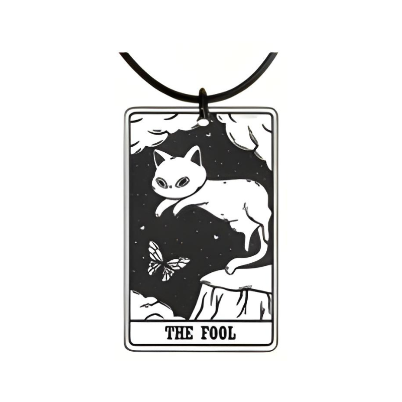 Cat-shaped pendant with 'The Fool' tarot card design on a white background