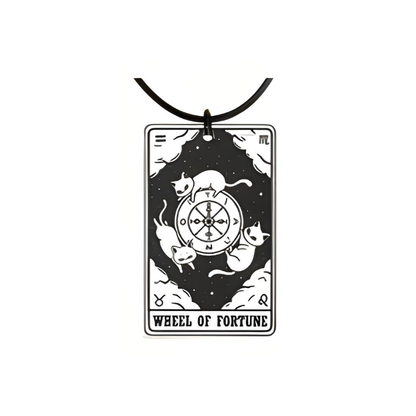 Pendant with 'Wheel of Fortune' design featuring cats and a compass on a white background