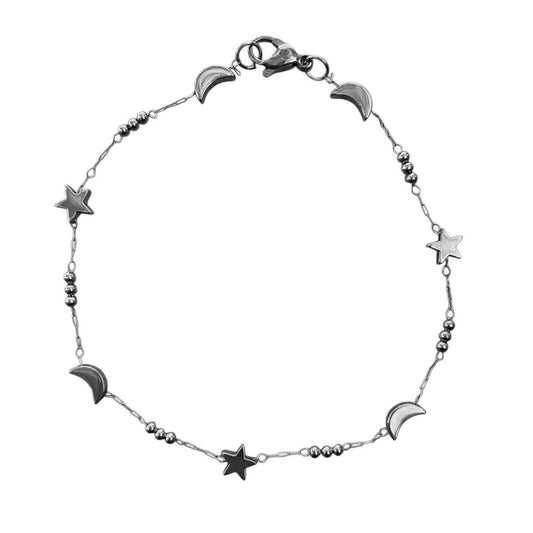 Silver anklet with star and moon charms on a white background