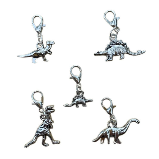 Wholesale Dinosaur Charms bundle of 5 unique dinosaur designs symbolizing strength, resilience, and timeless wonder, for jewelry making.