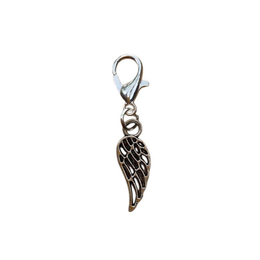 Silver angel wing charm on a white background for spiritual necklace or crystal bracelet