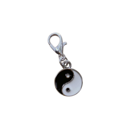 Yin and yang charm on a white background