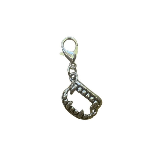 Vampire Teeth Charm symbolizing boldness, curiosity, and playful mischief, for spiritual necklaces and witchy crystal bracelets.
